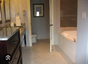 Jetted tub, hair dryer, towels, toilet paper