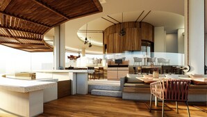 A modern kitchen with wooden cabinets, a central island, and a dining area with a bar stool. - Grand Hyatt Cancun Beach Resort – All Inclusive (Cancun)