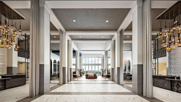 A spacious lobby with high ceilings, marble flooring, and a central seating area. - Cozy resort in enchanting Carlsbad at the flower fields (Carlsbad)