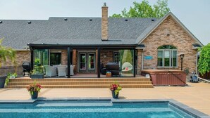 A house with a swimming pool, a covered patio, and a hot tub. - River front paradise,  boat, kayak, swim,  go to the racetrack, have fun, relax! (Cayuga)