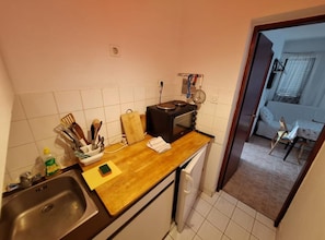 Fridge, stovetop, cookware/dishes/utensils