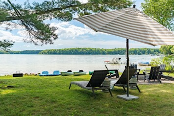 Welcome to The Dragonfly Nest in Lake Ann, Michigan! Enjoy 100 feet of private, sandy lakefront and green grass for plenty of space to relax and play games!
