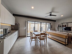 Fridge, microwave, blender, cookware/dishes/utensils