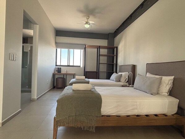 Premium bedding, desk, laptop workspace, free WiFi