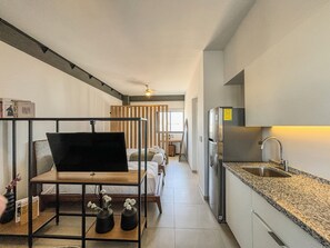 Standard Apartment, Multiple Beds | Television