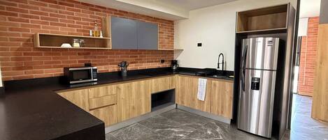 Fridge, microwave, stovetop, coffee/tea maker