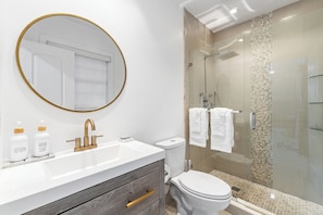 Shower, hair dryer, towels, soap