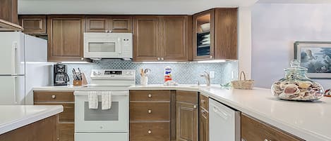Coffee/tea maker, fridge, microwave, oven