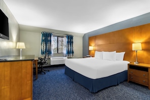 Premium bedding, desk, laptop workspace, blackout curtains