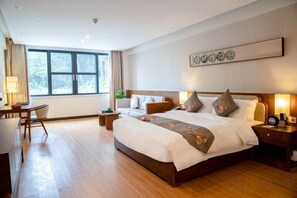 A hotel room with a large bed, bedside tables, a desk, and a window. - Guangzhou Mountain Villa (Guangzhou)