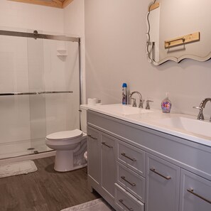 Shower, towels, soap, toilet paper