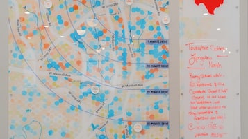 A map with location markers and a welcome sign for a hotel in Longview, TX.