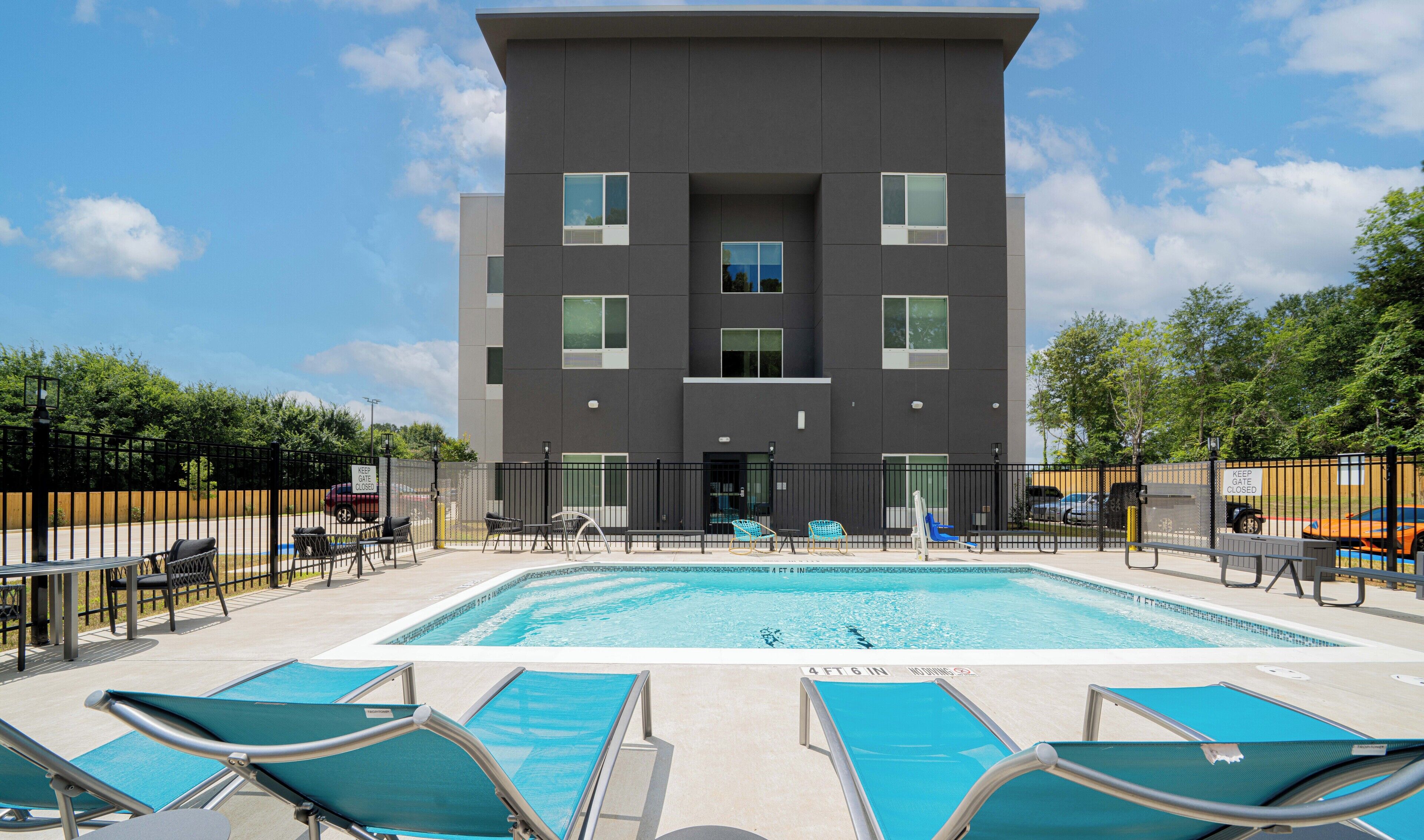 Seasonal outdoor pool, open 7:00 AM to 10:00 PM, pool loungers