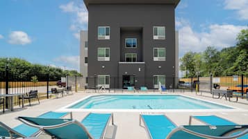 Seasonal outdoor pool, open 7:00 AM to 10:00 PM, pool loungers