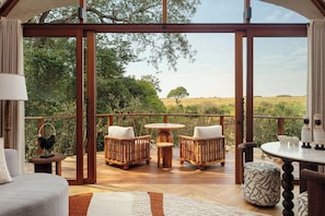 Suite, 1 King Bed, River View | Living area | Books