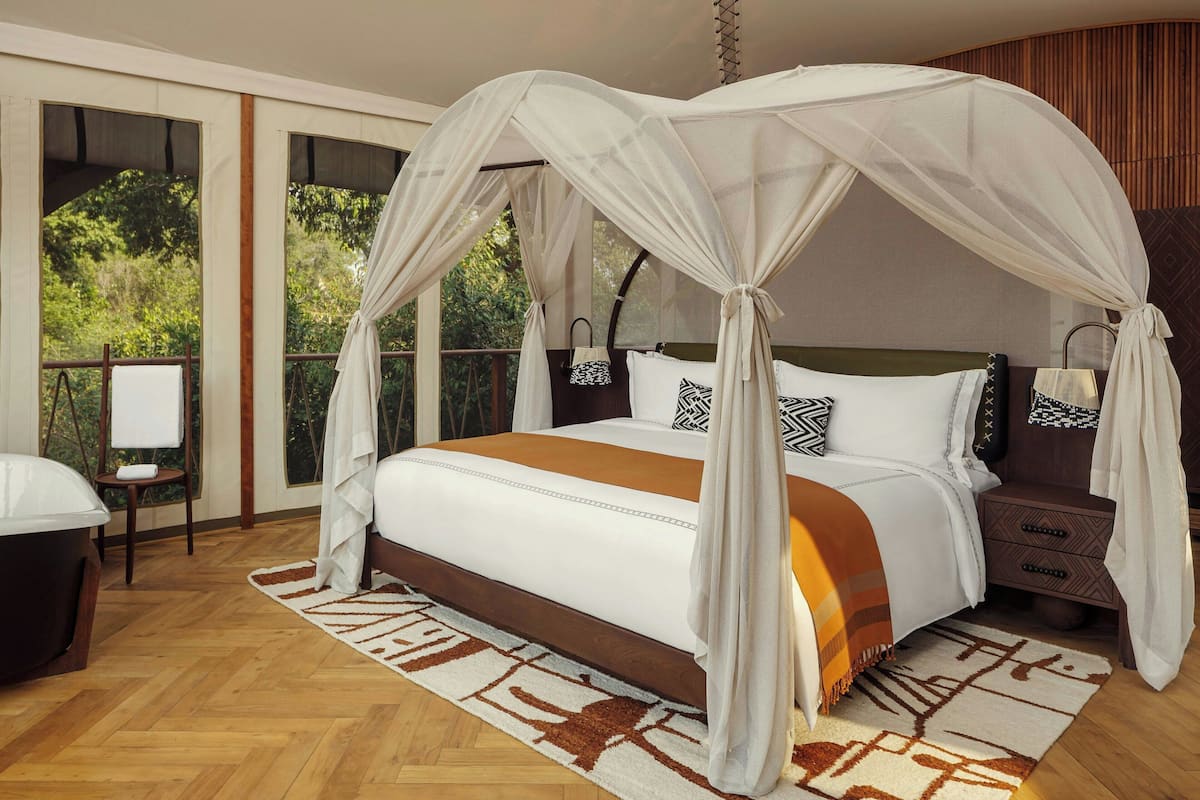 Suite, 1 King Bed, River View | Premium bedding, free minibar, in-room safe, individually decorated