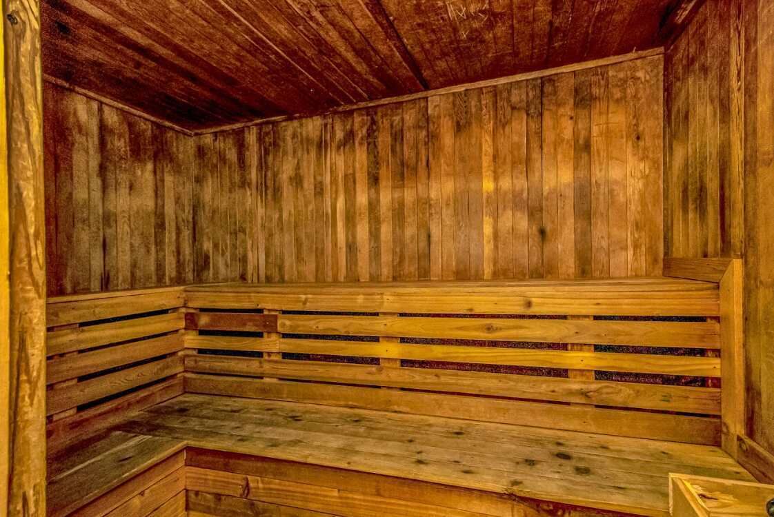 A sauna with wooden benches and walls.