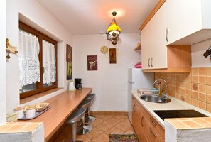 Fridge, stovetop, coffee/tea maker, cookware/dishes/utensils