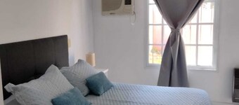 Charming 2-bedroom house in ColĂłn, close to the beach and downtown.