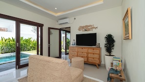 Villa, 2 Bedrooms, Pool View | Living area | 43-inch flat-screen TV with cable channels, TV