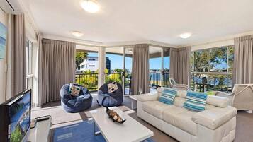 RIVA 2 Bed 2 Bath Superior Apartment | Living area | 55-inch Smart TV with digital channels