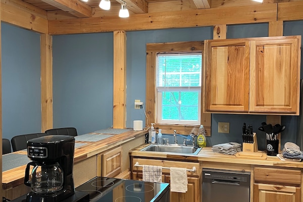 Fully outfitted kitchen includes water cooler and coffee service.