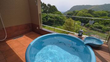 A swimming pool with a view of a mountainous landscape.