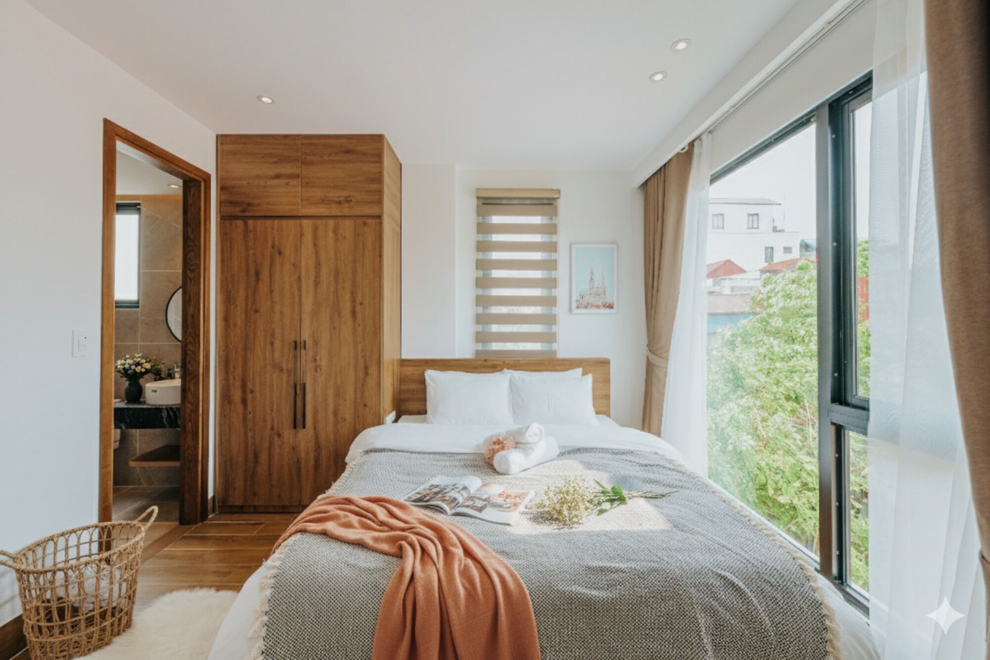 A bedroom with a bed, wooden wardrobe, and a window with a view of buildings.