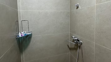 Shower, hair dryer, slippers, towels