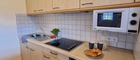 Fridge, microwave, stovetop, coffee/tea maker