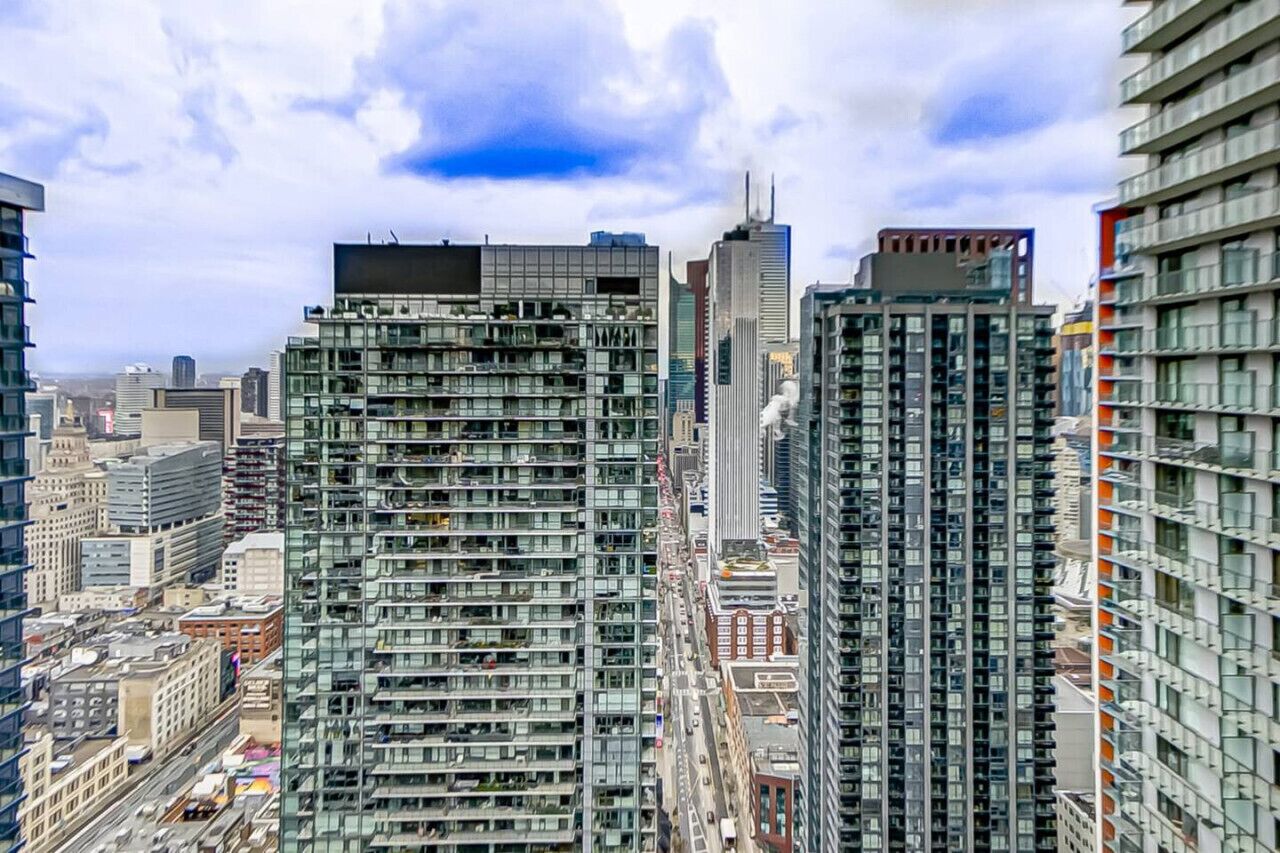 A high-rise building with multiple floors, large windows, and a modern architectural design.
