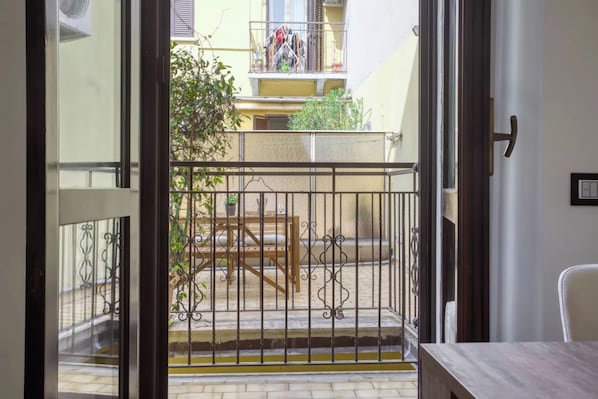 Enjoy a balcony with a wrought iron railing, perfect for taking in the views of the surrounding cityscape.