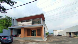 A modern two-story building with a flat roof, large windows, and a covered entrance. - Nusantara Bypass Mojokerto By Reccoma (Mojokerto)