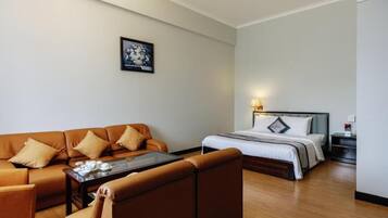 Superior Double Room, City View | Living area | TV