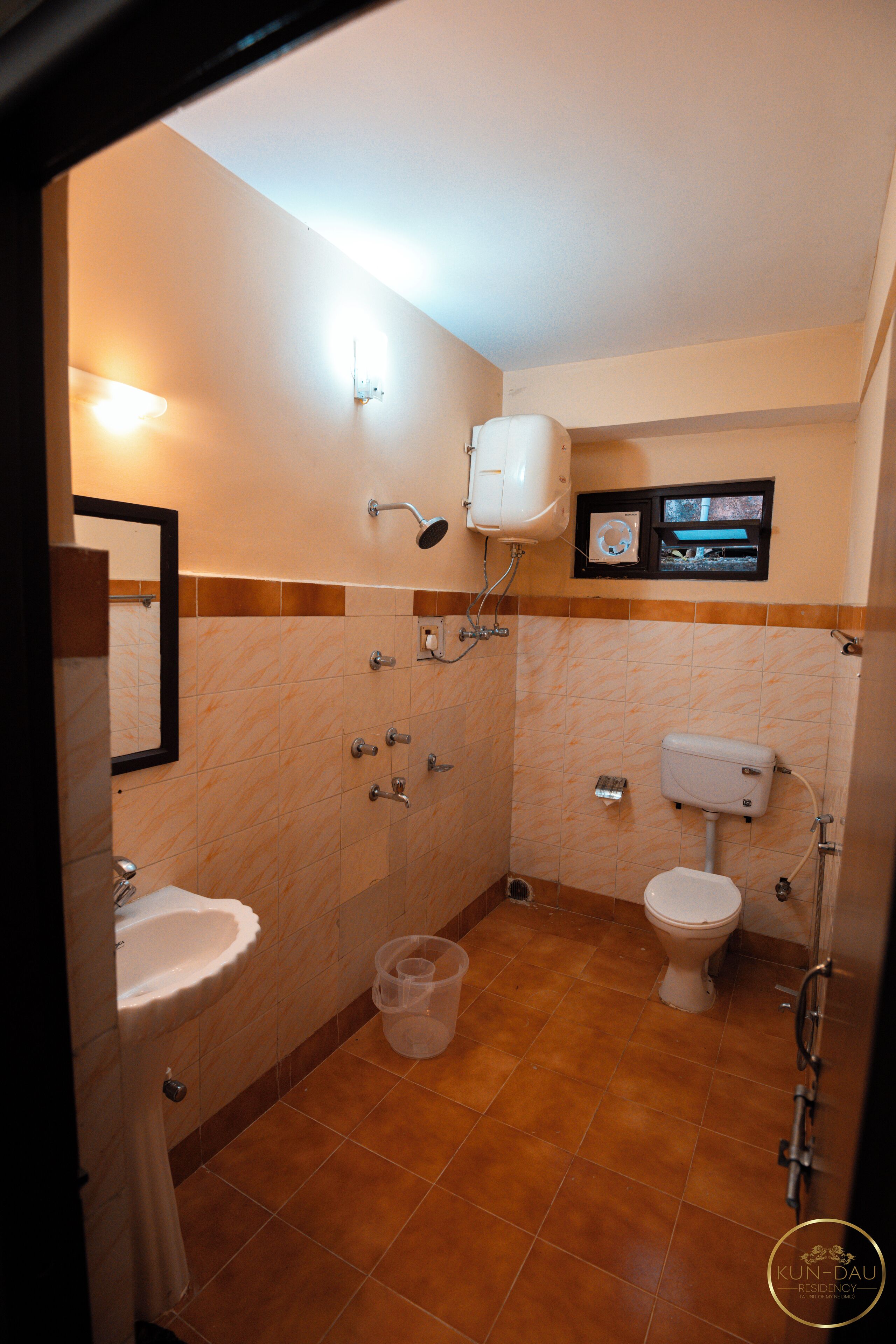 A bathroom with a sink, toilet, and shower.