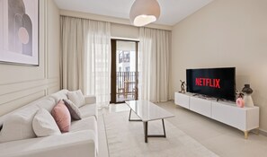 55-inch Smart TV with digital channels, Netflix, streaming services - Pink Panther Soft Glam 1BR in Surf 2 (Dubai)