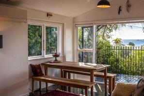 Dining - La Casa Al Mare - La Casa Al Mare is a restored 1930s cottage with stunning sea views over Onetangi Beach. It features timber floors, WiFi, Smart TV, and a full kitchen. Sleeps 5 across 3 bedrooms, including a separate sleepout. Enjoy sunny decks, op (Waiheke Island)