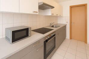 Fridge, coffee/tea maker, cookware/dishes/utensils