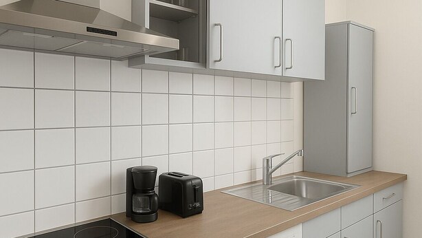 Une cuisine moderne équipée d’une cuisinière, d’un grille-pain et d’une machine à café.