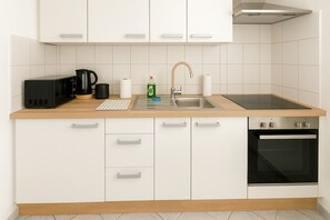 Fridge, microwave, oven, cookware/dishes/utensils