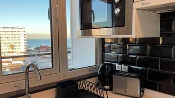 Coffee/tea maker, fridge, microwave, oven