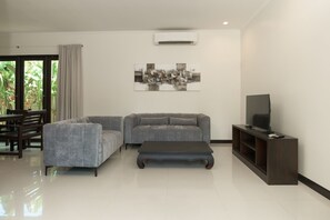 Deluxe Villa, 3 Bedrooms, Pool View | Living area | 55-inch flat-screen TV with cable channels