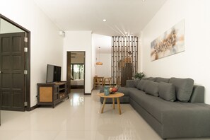 Deluxe Villa, 2 Bedrooms, Pool View | Living area | 55-inch flat-screen TV with cable channels