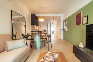 Apartment, City View | Living area | 50-cm flat-screen TV with cable channels