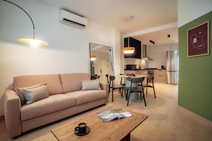 Apartment, 1 Bedroom | Living area | 50-cm flat-screen TV with cable channels