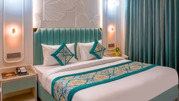 Premium bedding, free minibar items, desk, soundproofing