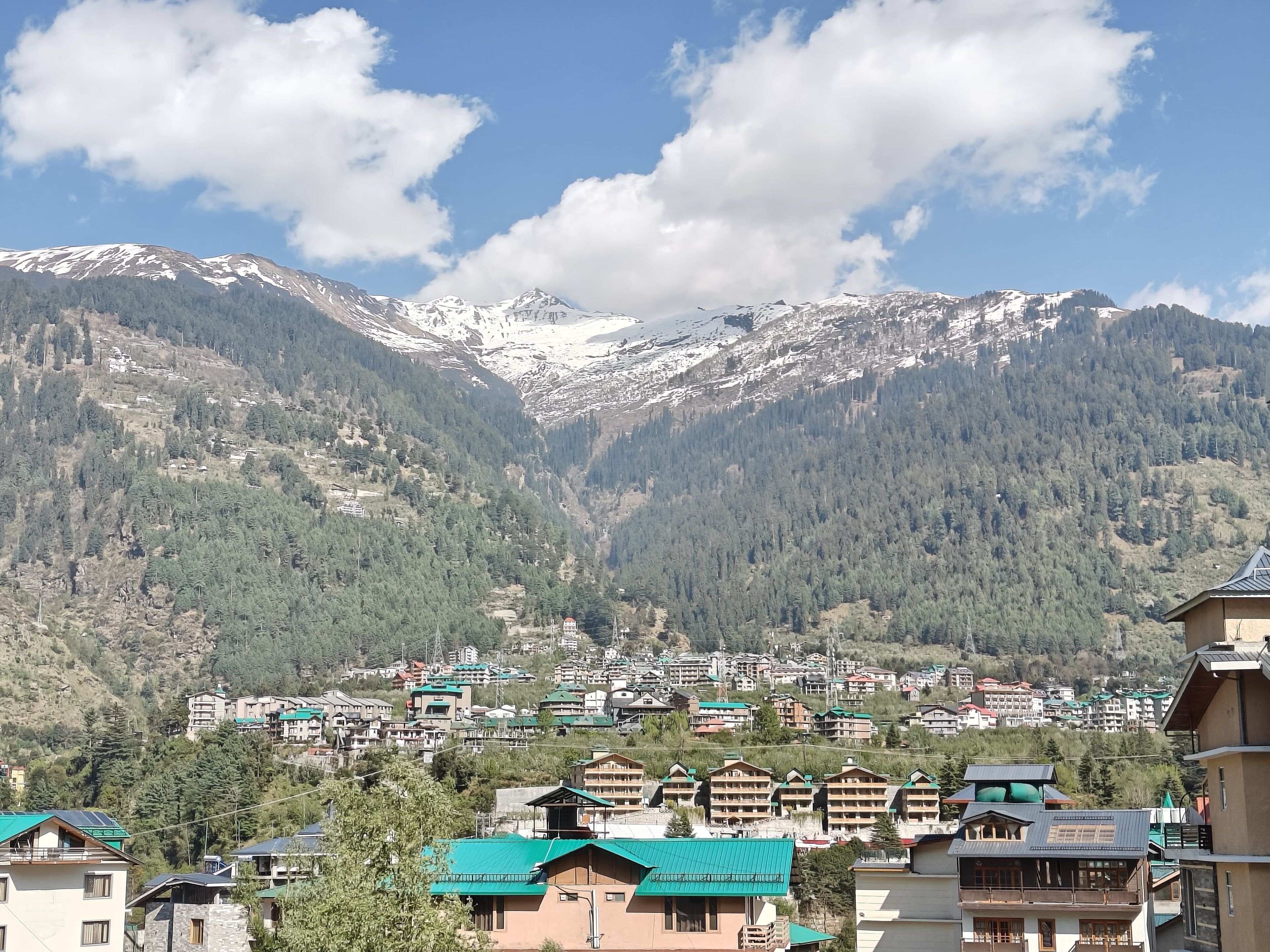 A mountainous landscape with a town in the valley.