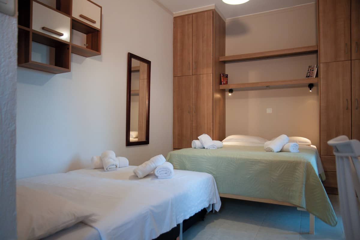 Luxury Triple Room 101, Partial Sea View | Individually decorated, individually furnished, laptop workspace