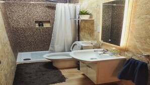 A compact bathroom with a shower, toilet, and sink. - Modern 3 Bedroom Penthouse With Rooftop Views (Msida)
