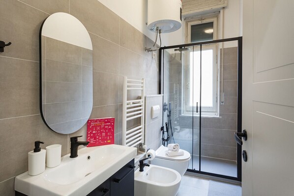 Shower, hair dryer, towels, soap